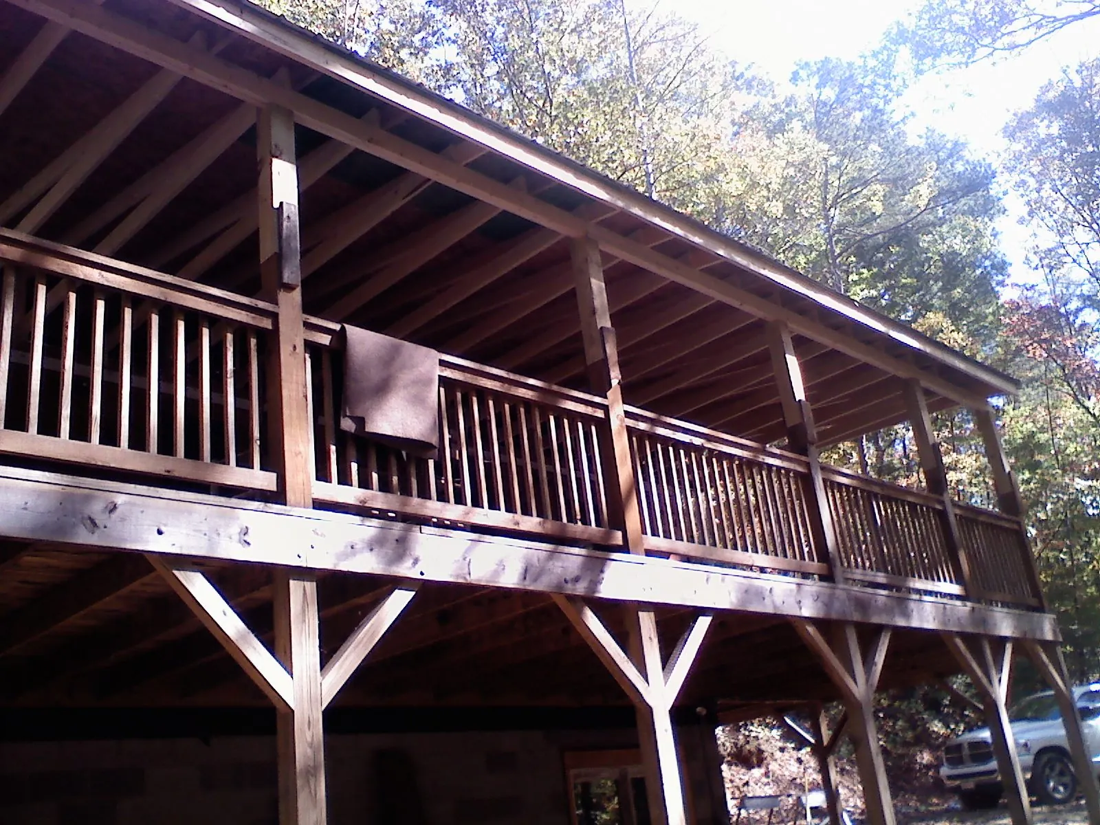 Timber framing under a new elevated porch and deck — Roof Leak Repair in Saint John by Roofing Brothers